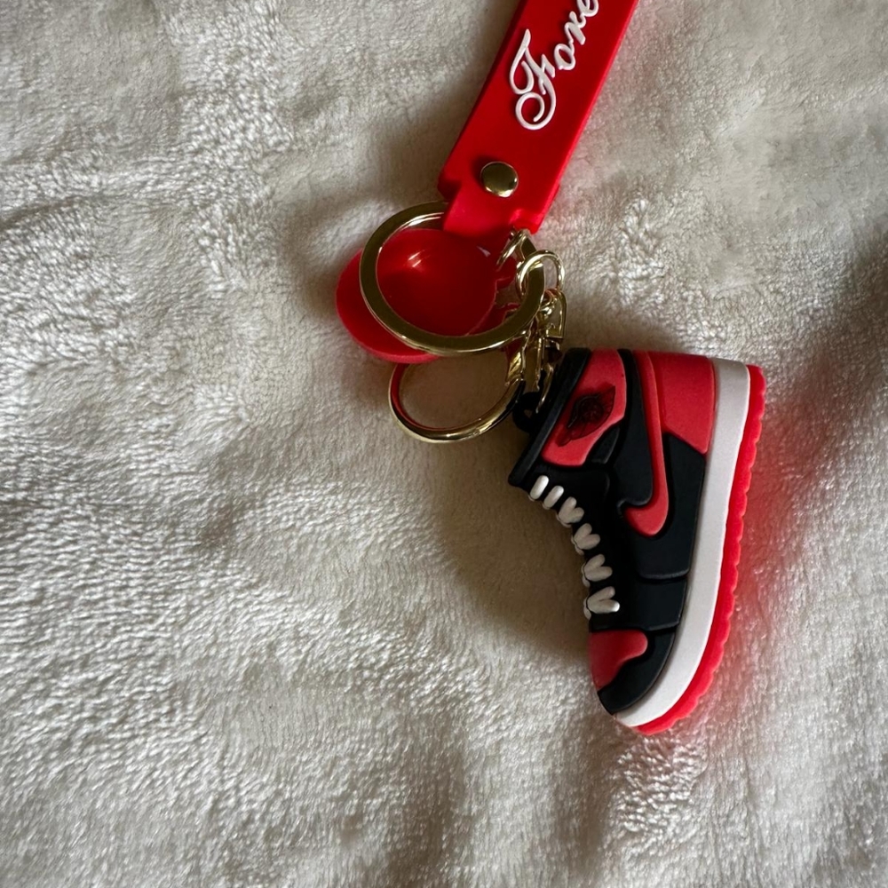 red nike shoe keychain